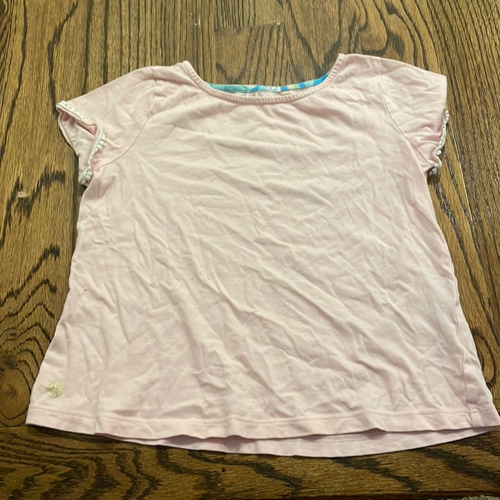 A Lilly Pulitzer pink top with no flaws.